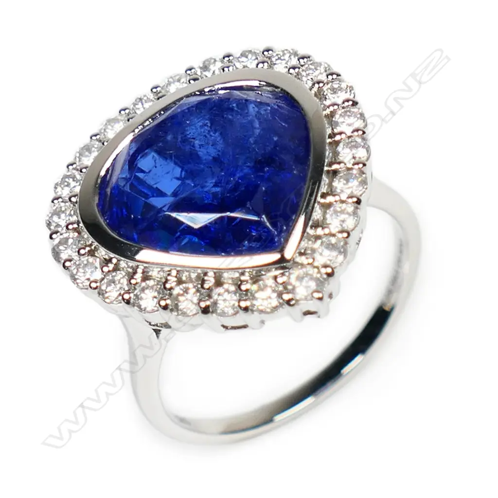 A 14ct white gold, tanzanite and diamond halo cocktail ring, Image 1++
