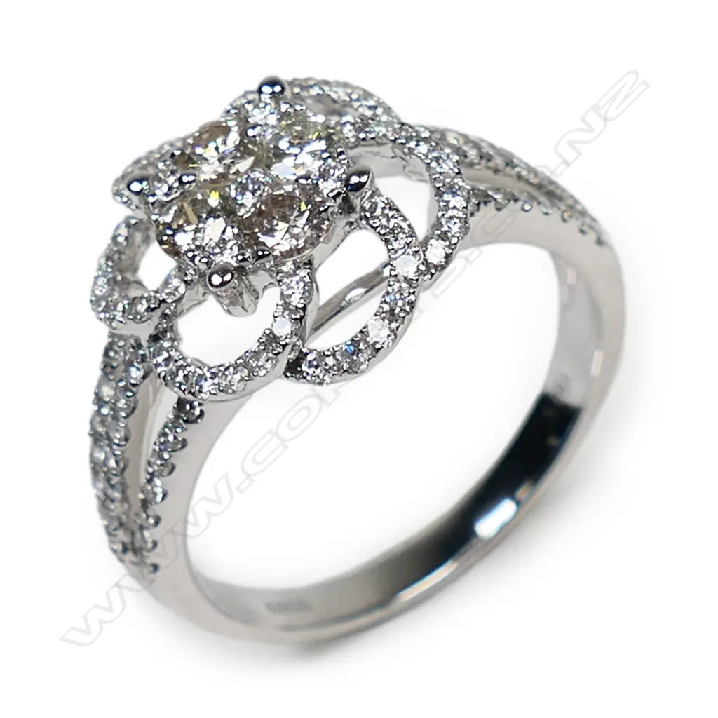 An 18ct white gold and diamond cluster ring, Image 1++