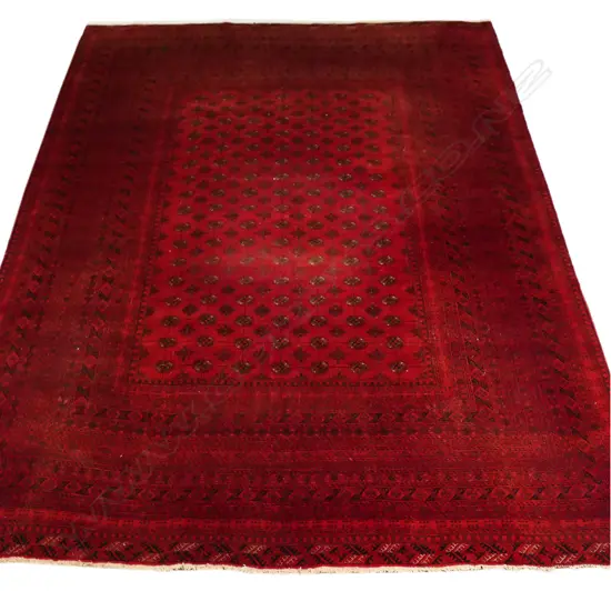A large Turkman Tekke hand-knotted carpet,
