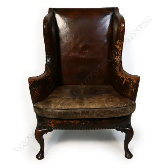 A Victorian leather wing back chair,