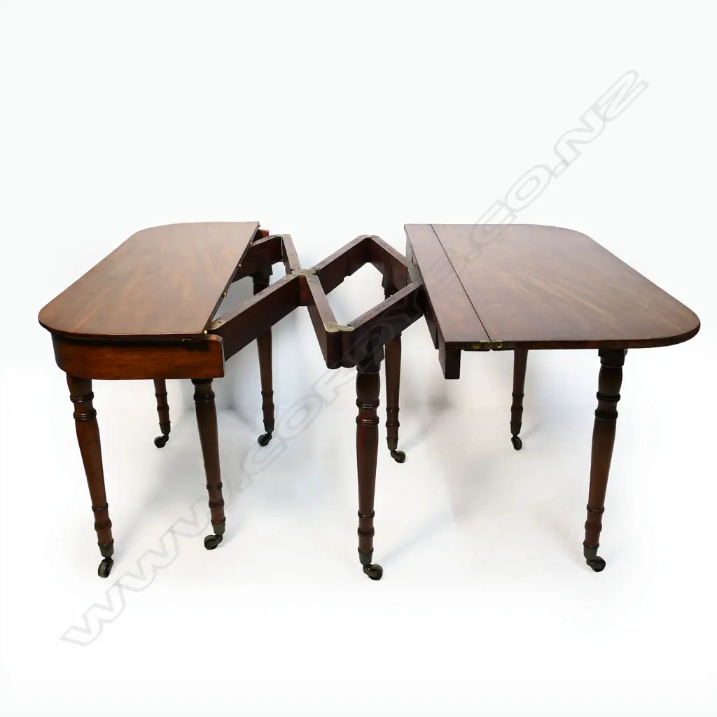 A D-end mahogany concertina action folding dining table, Image 1++