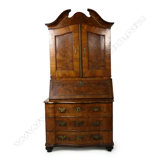 A 19thC German walnut bombe bureau bookcase,