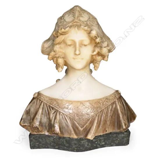 An Art Nouveau French carved alabaster bust of a young Breton woman,