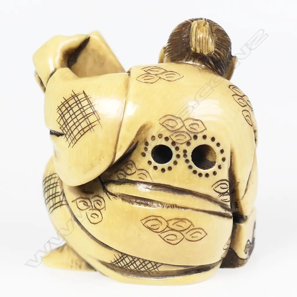 An ivory netsuke modelled as a box maker, Image 1++