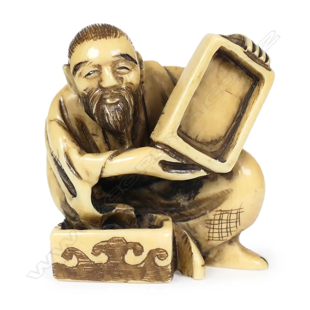 An ivory netsuke modelled as a box maker, Image 1++