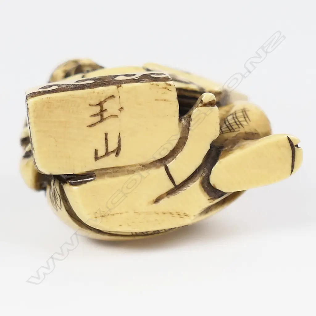 An ivory netsuke modelled as a box maker, Image 1++