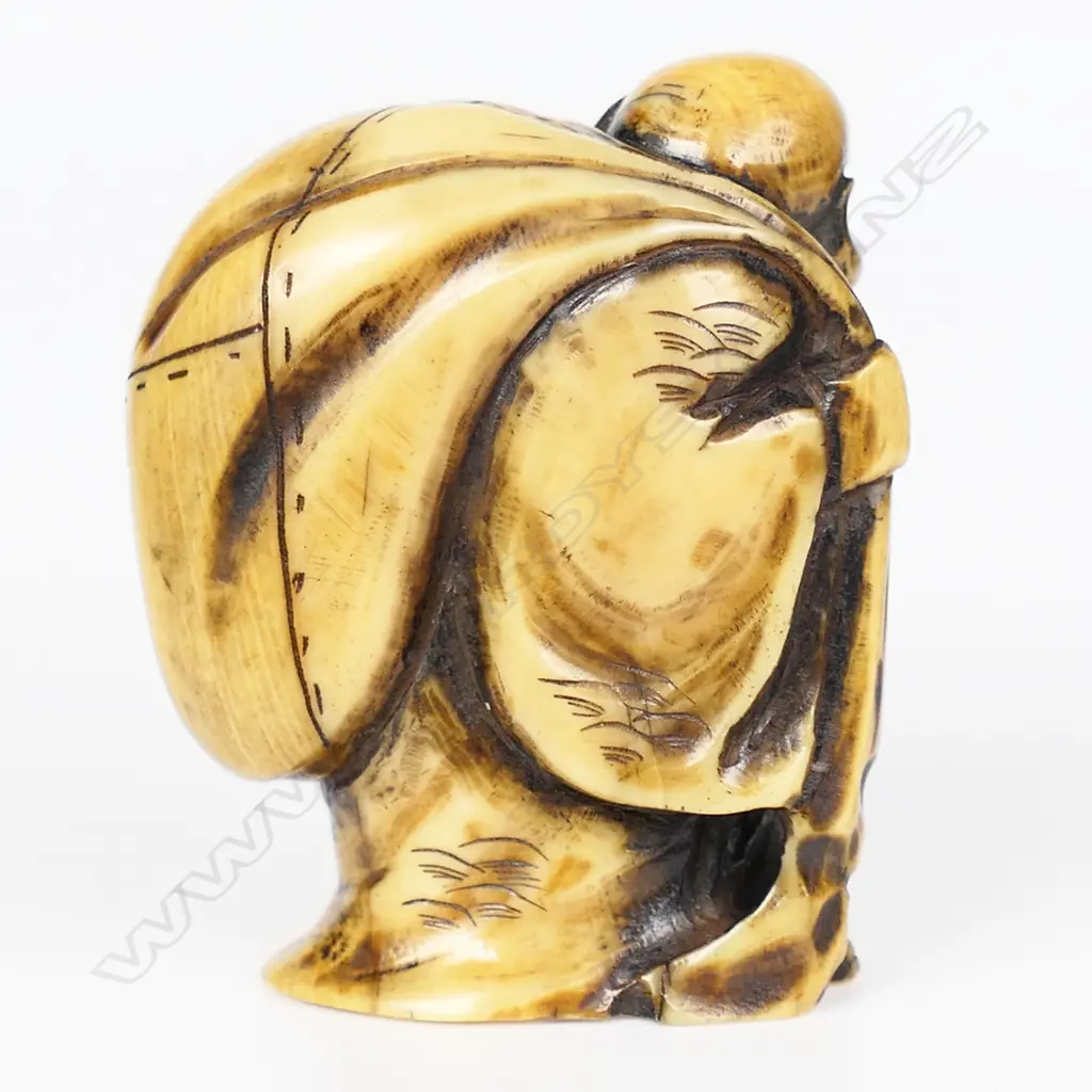 An ivory netsuke of Hotei, Image 1++