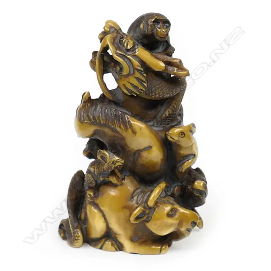 An ivory netsuke study as a Zodiac pyramid,