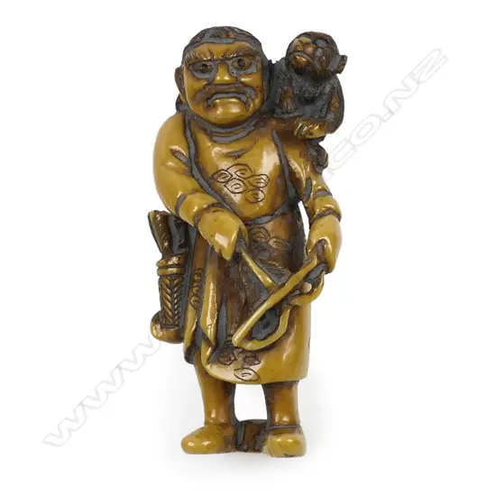 Ivory netsuke of a man with monkey,