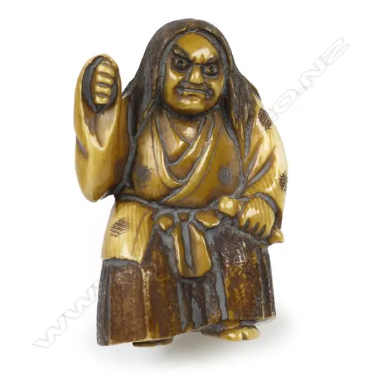 Ivory netsuke of an elderly woman,