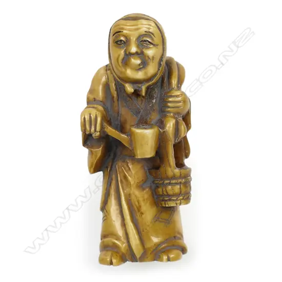 Ivory netsuke of an elderly woman,