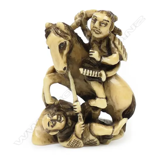 Ivory netsuke of two men battling with a horse,