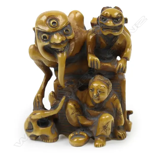 Ivory netsuke of a demon group with old woman,