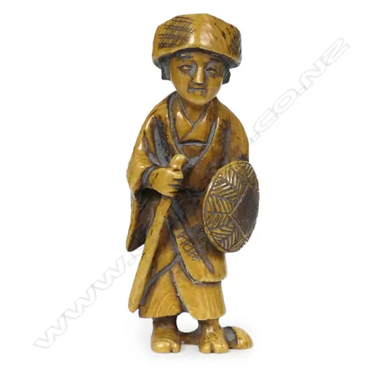 An ivory netsuke study of a woman,