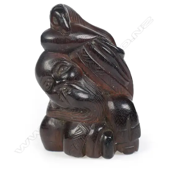 A Meiji carved dark wood netsuke study,