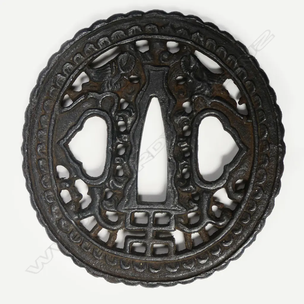 An 18thc oval iron namban-style tsuba, Image 1++