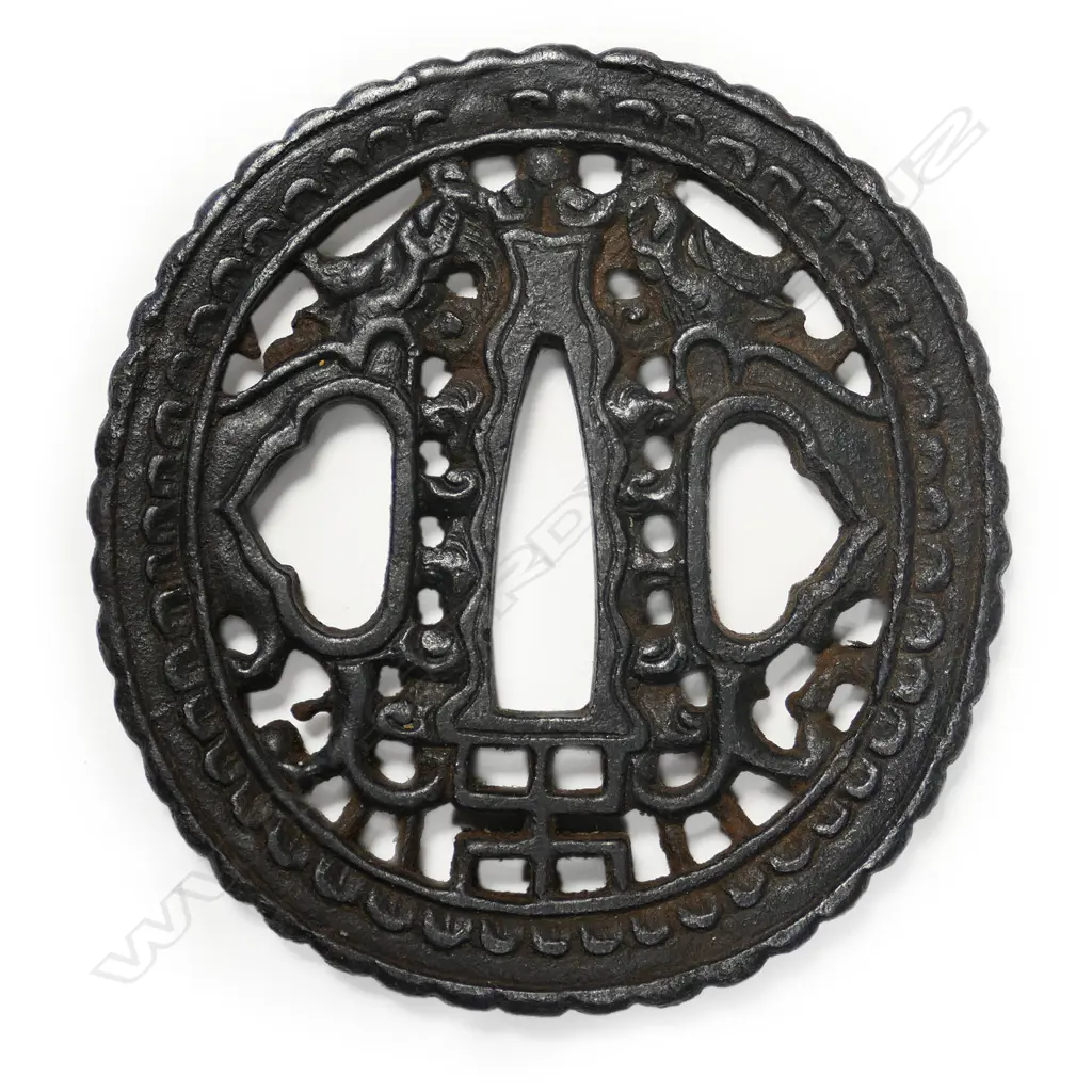 An 18thc oval iron namban-style tsuba, Image 1++