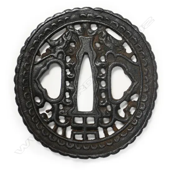 An 18thc oval iron namban-style tsuba,