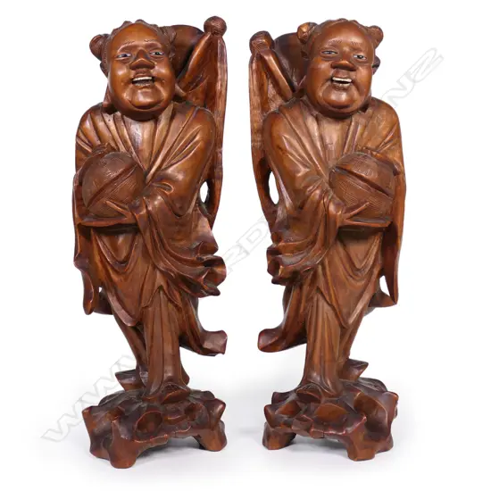 A pair of old Chinese carved hardwood figures,