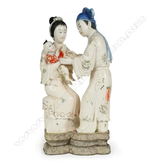 A mid 20thC Chinese carved ivory family group,