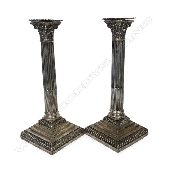 A pair of late Victorian silver candlesticks,