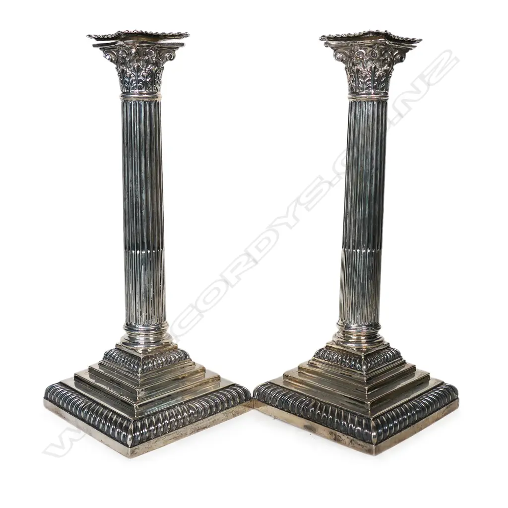 A pair of late Victorian silver Corinthian column candlesticks, Image 1++