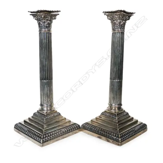 A pair of late Victorian silver Corinthian column candlesticks,