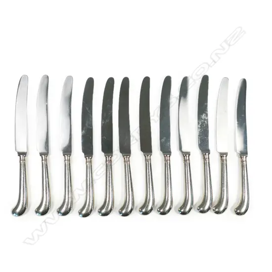 A set of twelve silver pistol grip dinner knives,