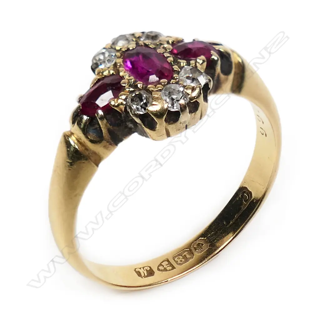 An early 20thC 18ct gold ruby and diamond cluster ring, Image 1++