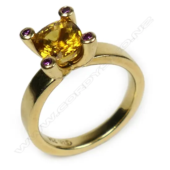 An 18ct gold yellow sapphire and diamond ring,
