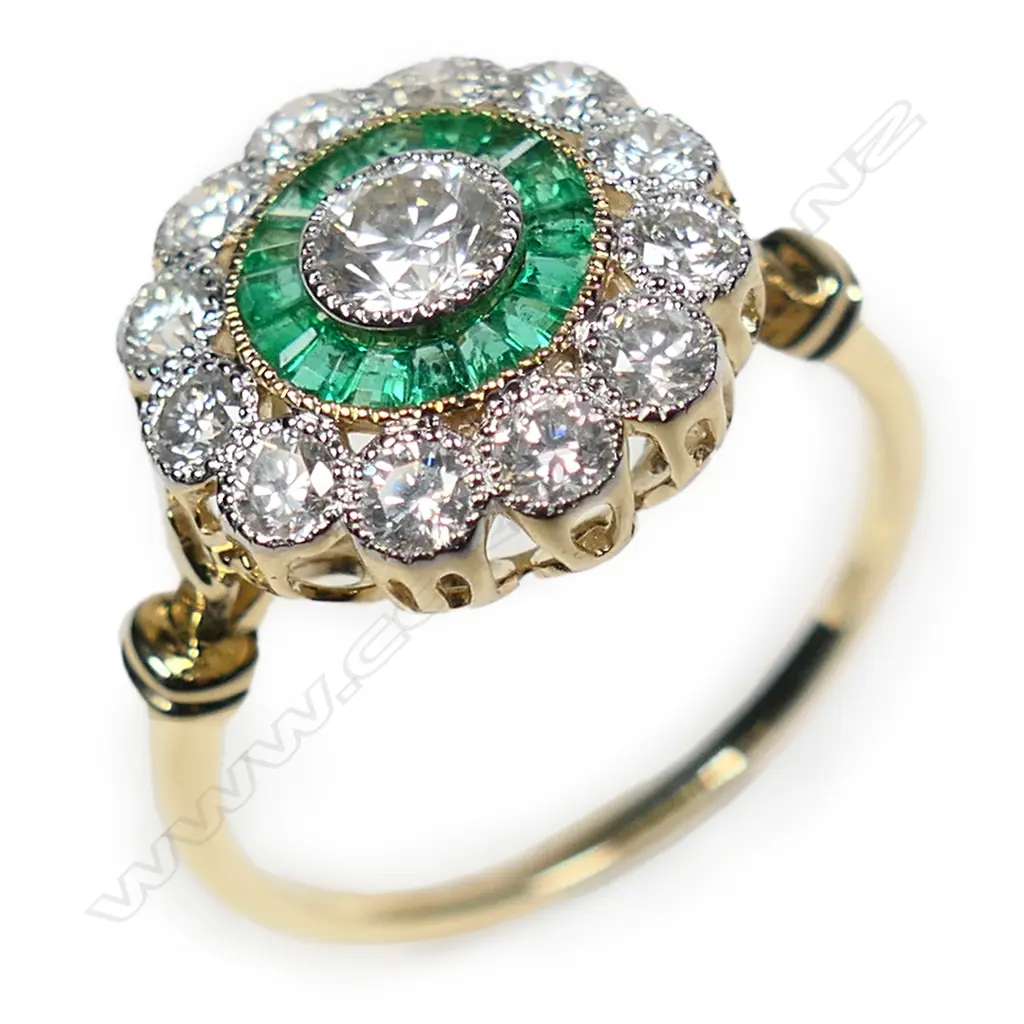 A 14ct gold emerald and diamond halo ring, Image 1++
