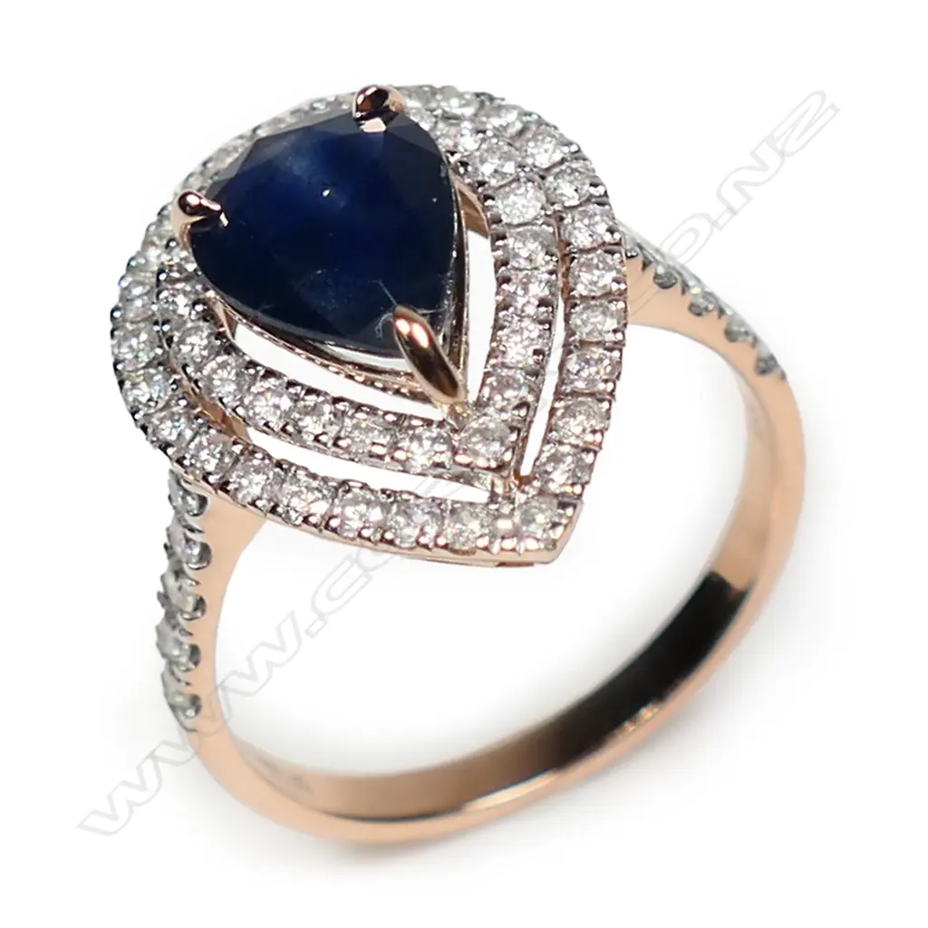 A 14ct rose gold sapphire and diamond double halo ring, Image 1++