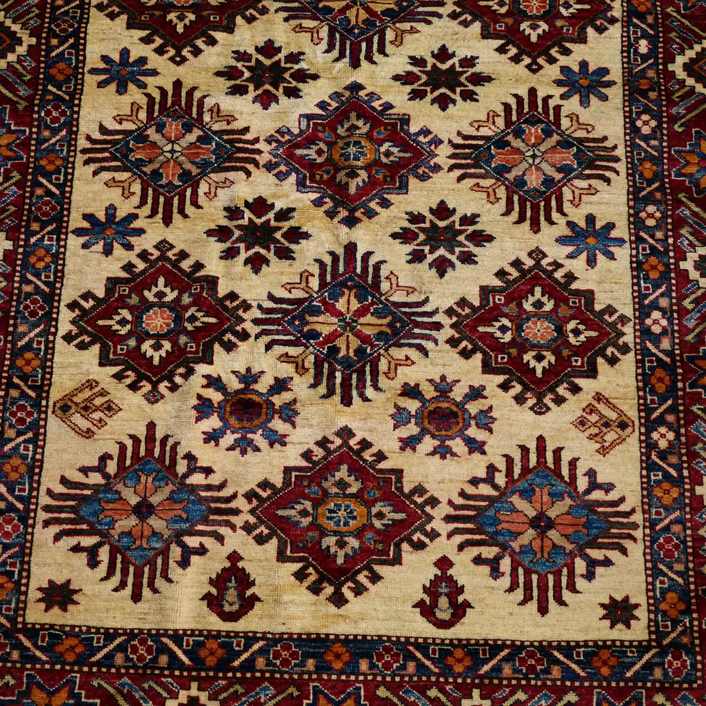 A hand knotted wool pile Kazak rug, Image 1++