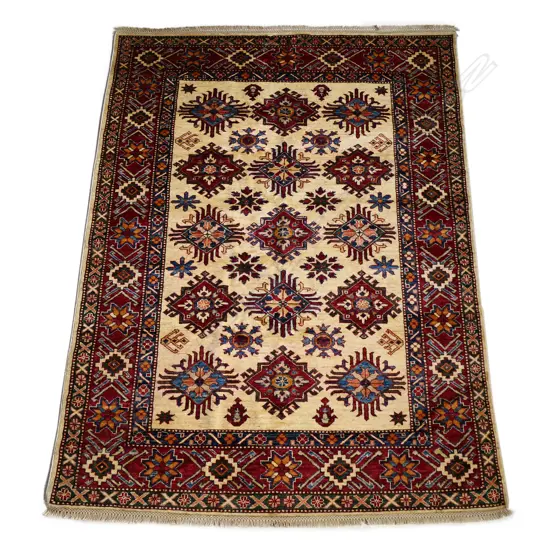 A hand knotted wool pile Kazak rug,