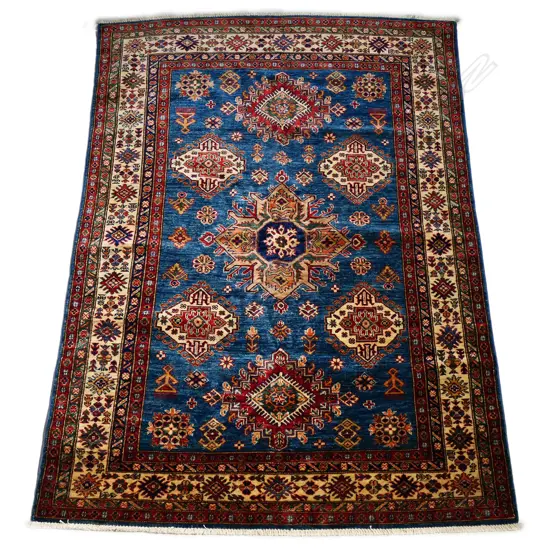 A hand knotted wool pile Kazak rug,