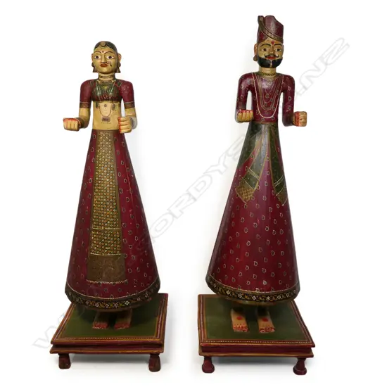 A pair of tall 1920s hand-painted wooden Isar Ganaur Maharaja and Maharani figures,