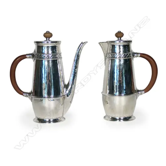 A fine pair of Liberty and Co silver cafe au lait pots,