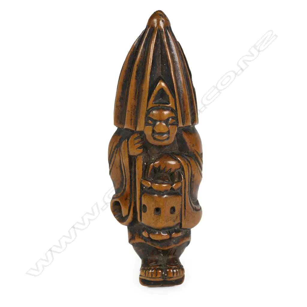 A Japanese Meiji period carved netsuke study of a man with lantern and rain parasol, Image 1++