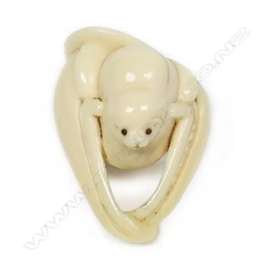 An uncommon subject 'bat eating fruit' ivory netsuke,