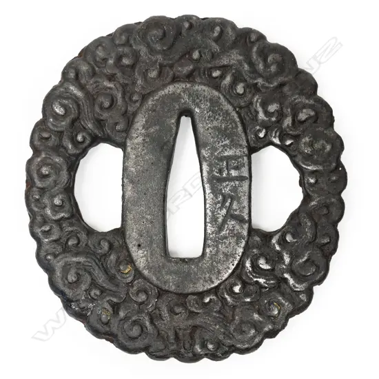 A Japanese Edo period iron Namban style wakizashi tsuba,