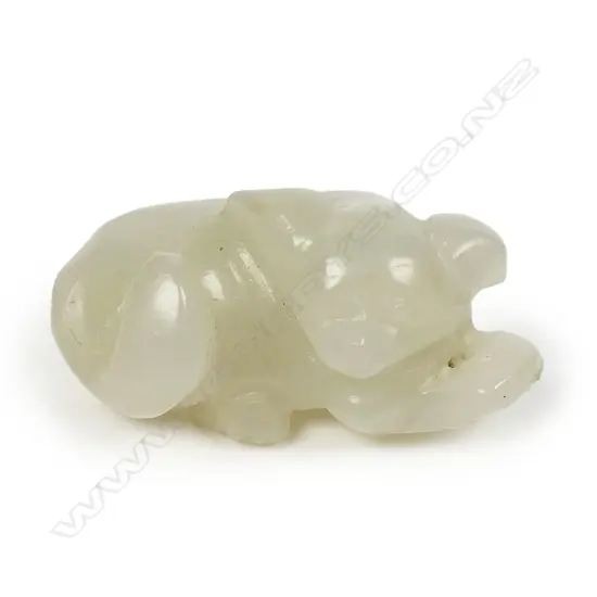 An old Chinese jade carved small recumbent animal pendant/handling piece,