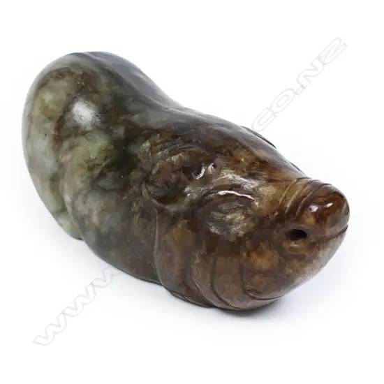 An oriental old carved jade pig handling piece,