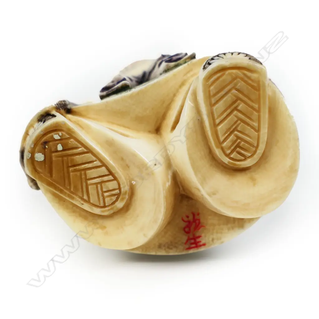 A mid 20thC oriental solid carved ivory okimono figure of Daikokuten (The God of Plenty), Image 1++