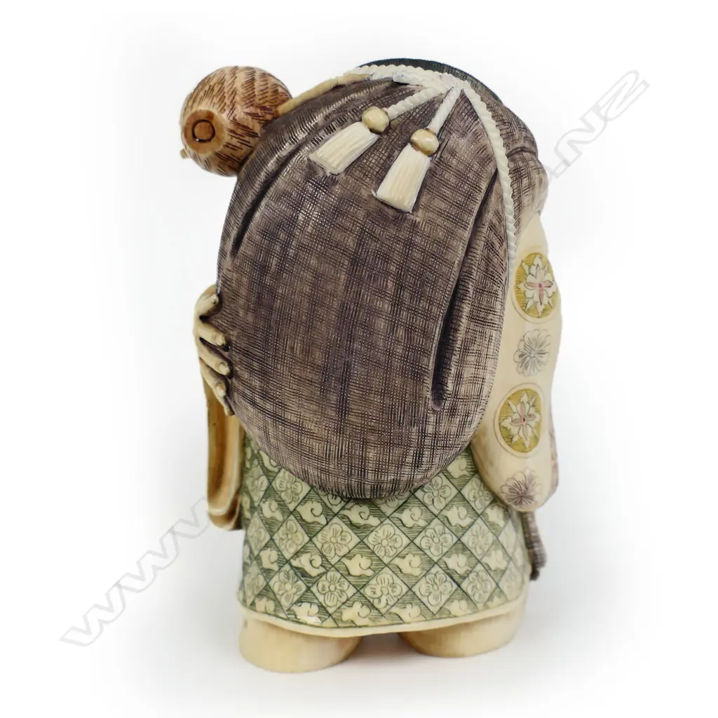 A mid 20thC oriental solid carved ivory okimono figure of Daikokuten (The God of Plenty), Image 1++