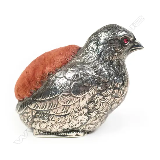 An early 20thC silver large chick pin cushion,