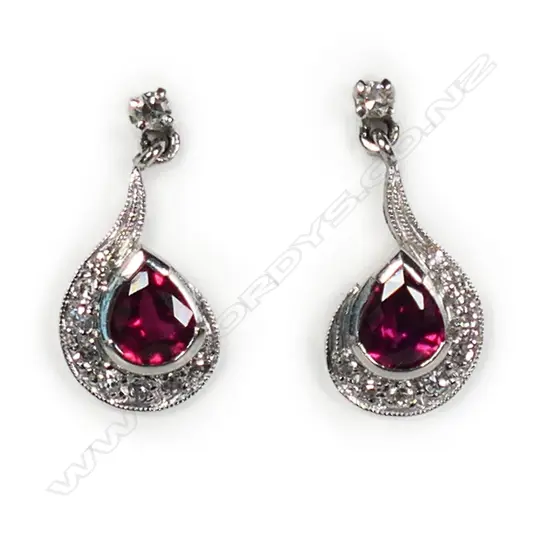 A pair of 18ct white gold ruby and diamond drop earrings,