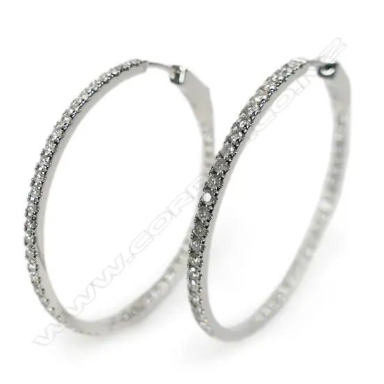 A pair of 14ct white gold and diamond hoop earrings,