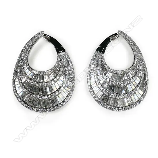 A stylish pair of 18ct white gold and multi diamond wide tapered crescent earrings,