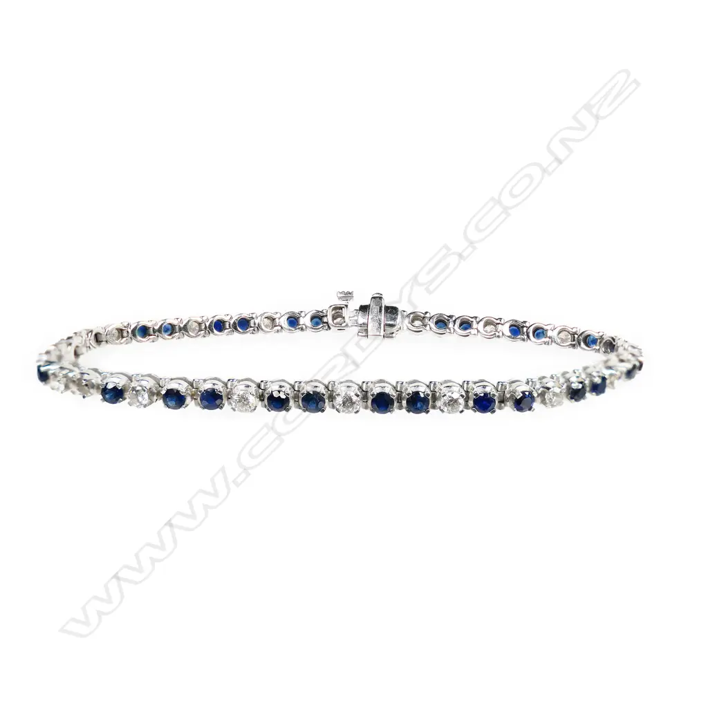 A 9ct white gold sapphire and diamond tennis bracelet, Image 1++
