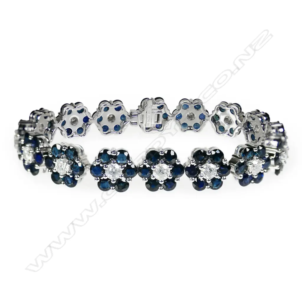 A 14ct white gold sapphire and diamond floral design bracelet, Image 1++